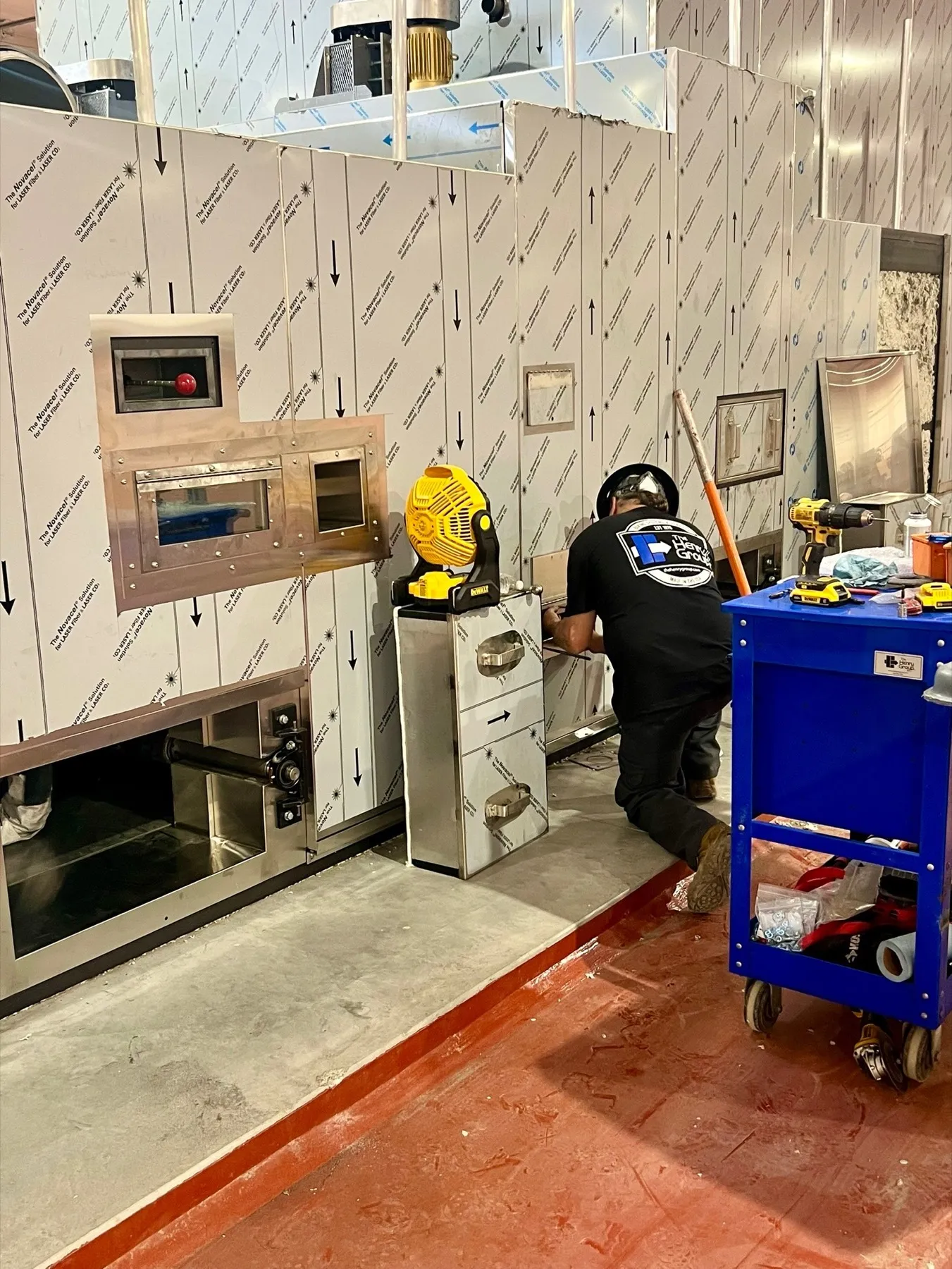 THG technician working beside installed equipment