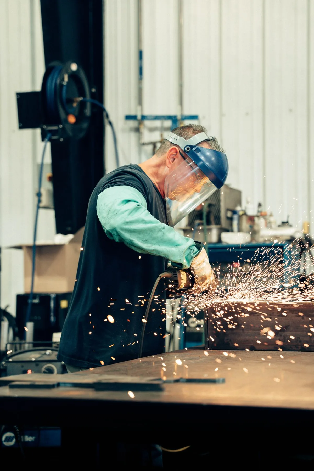 Finishing a metal part at the fabrication bench