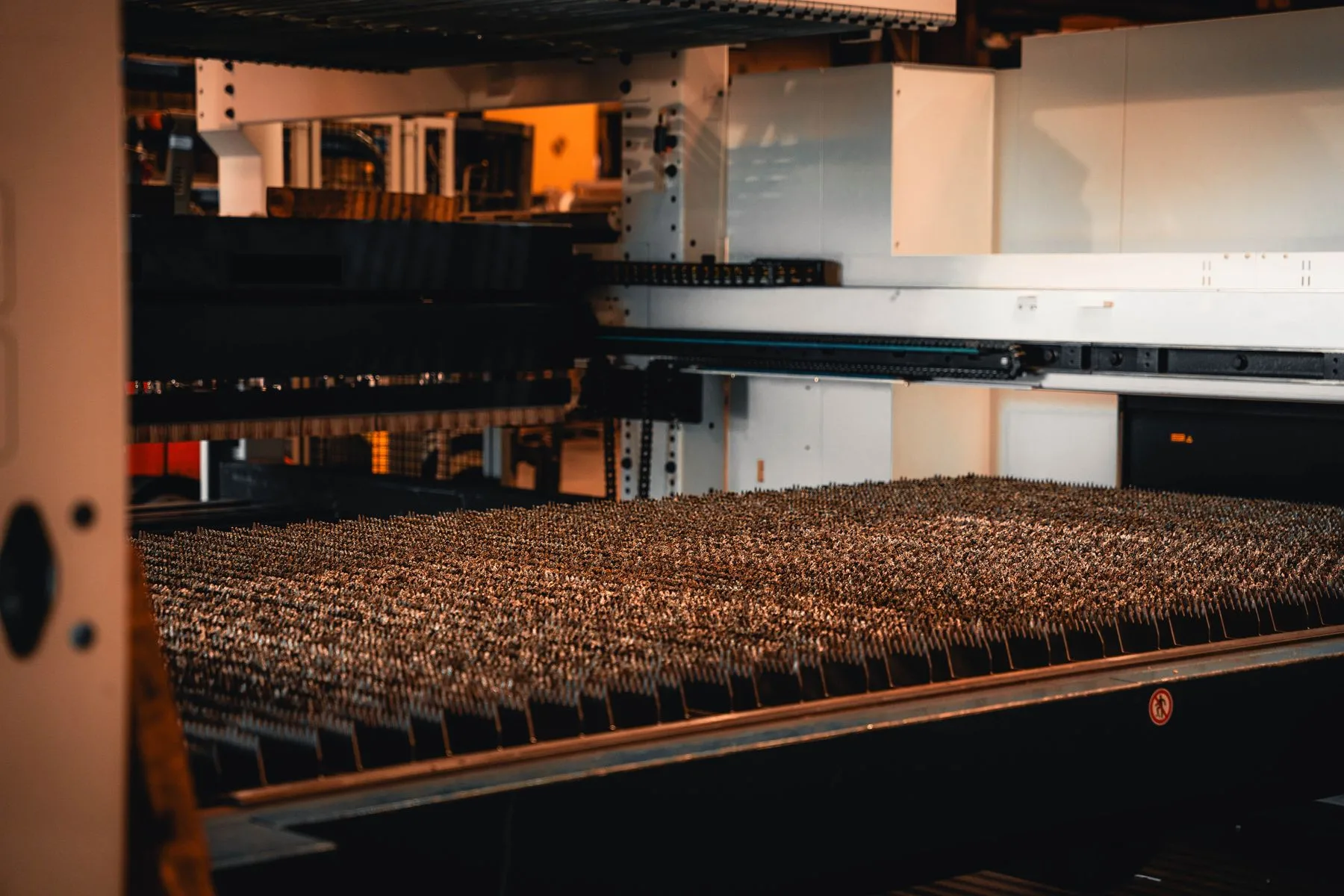 Wide view of the flat-sheet laser support bed and loading equipment