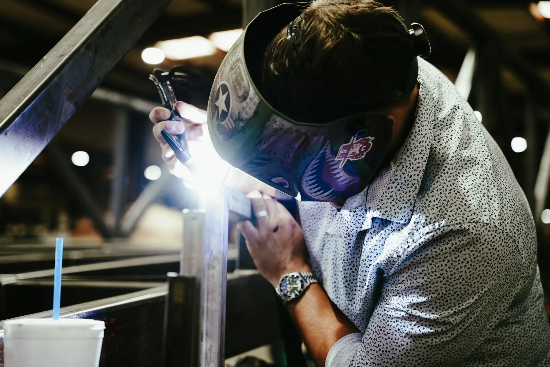 Close view of a welder joining a metal assembly