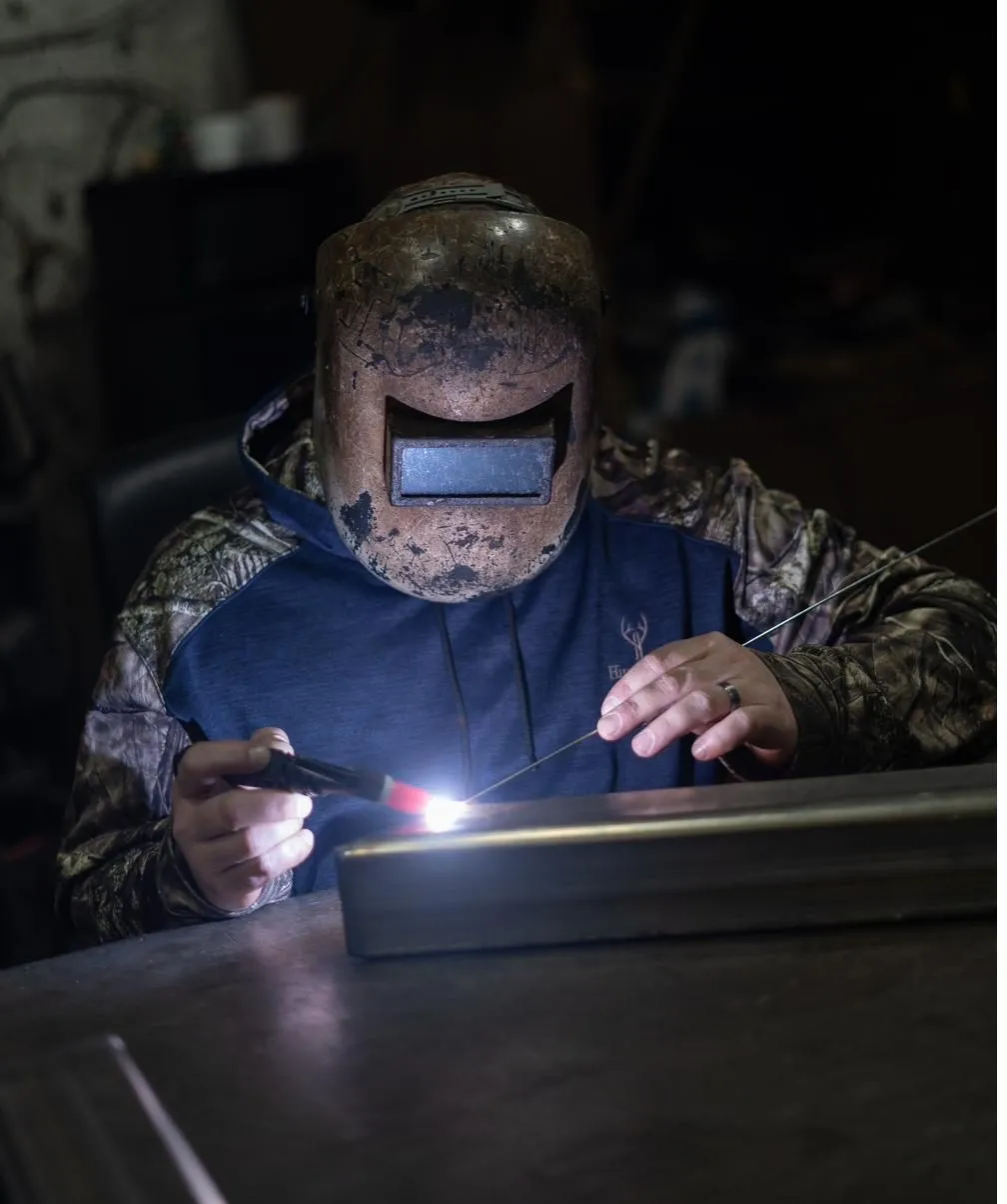 Welding a metal assembly in the THG workshop